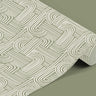 Contact 1033: Rolled sage green contact paper with a white geometric pattern featuring interwoven arcs and lines, displayed on a matching green surface.