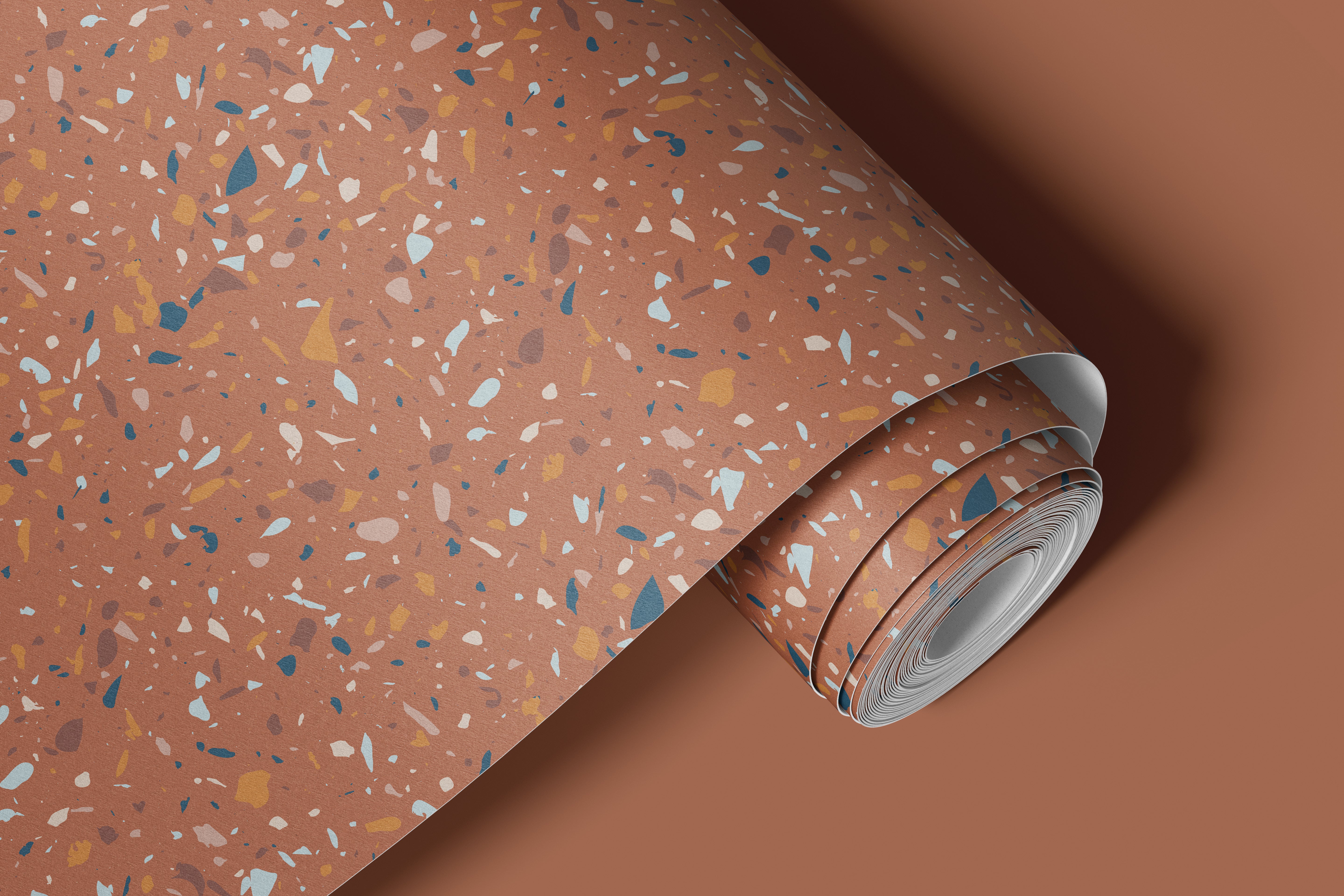 Contact paper 109: A terracotta terrazzo-style contact paper featuring warm burnt orange, blue, and beige stone fragments in an abstract speckled pattern, perfect for modern and Mediterranean-inspired interiors.
