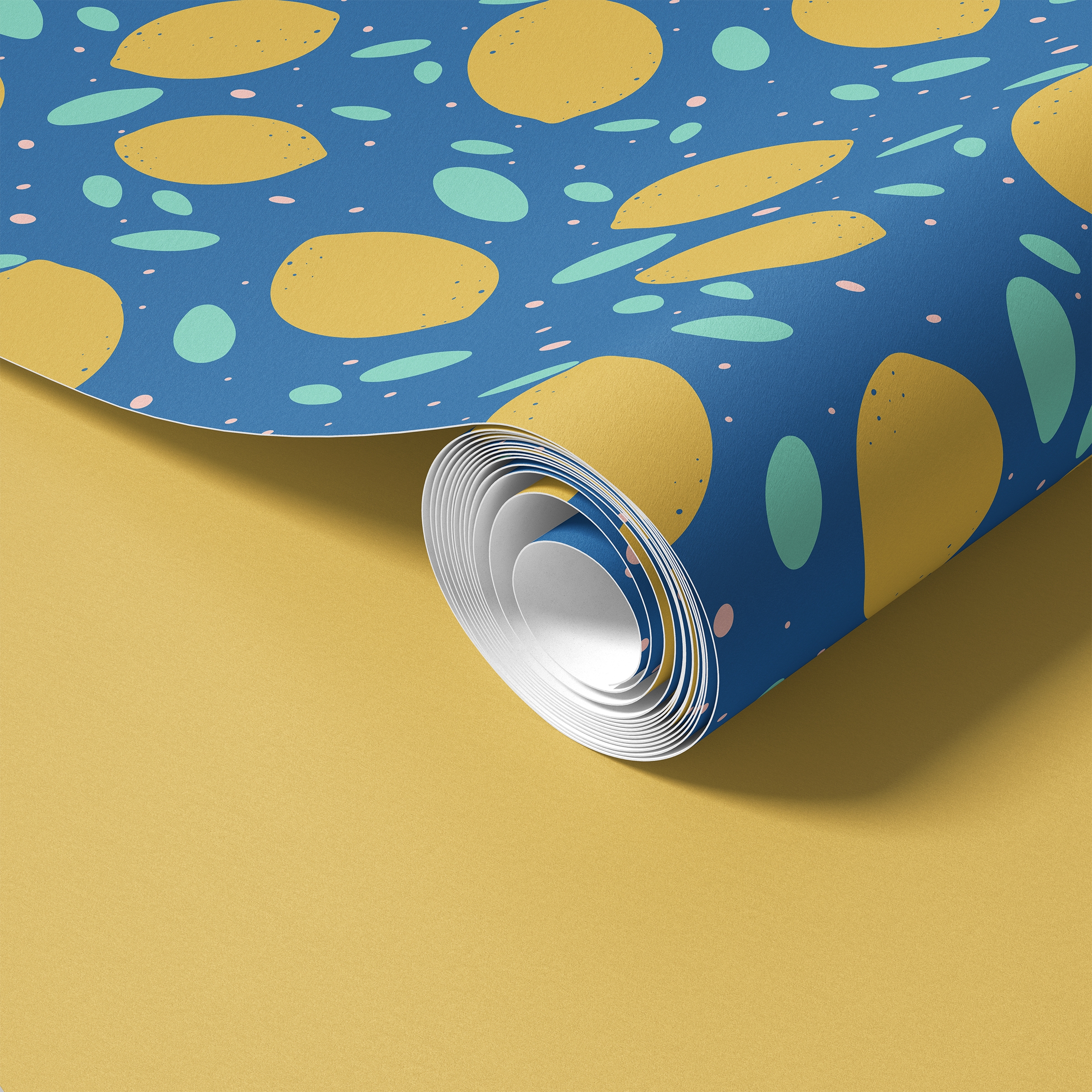 Contact paper 1289: Roll of colorful contact paper featuring abstract yellow citrus shapes, mint ovals, and pink speckles on a bright blue background, unrolling on a yellow surface.