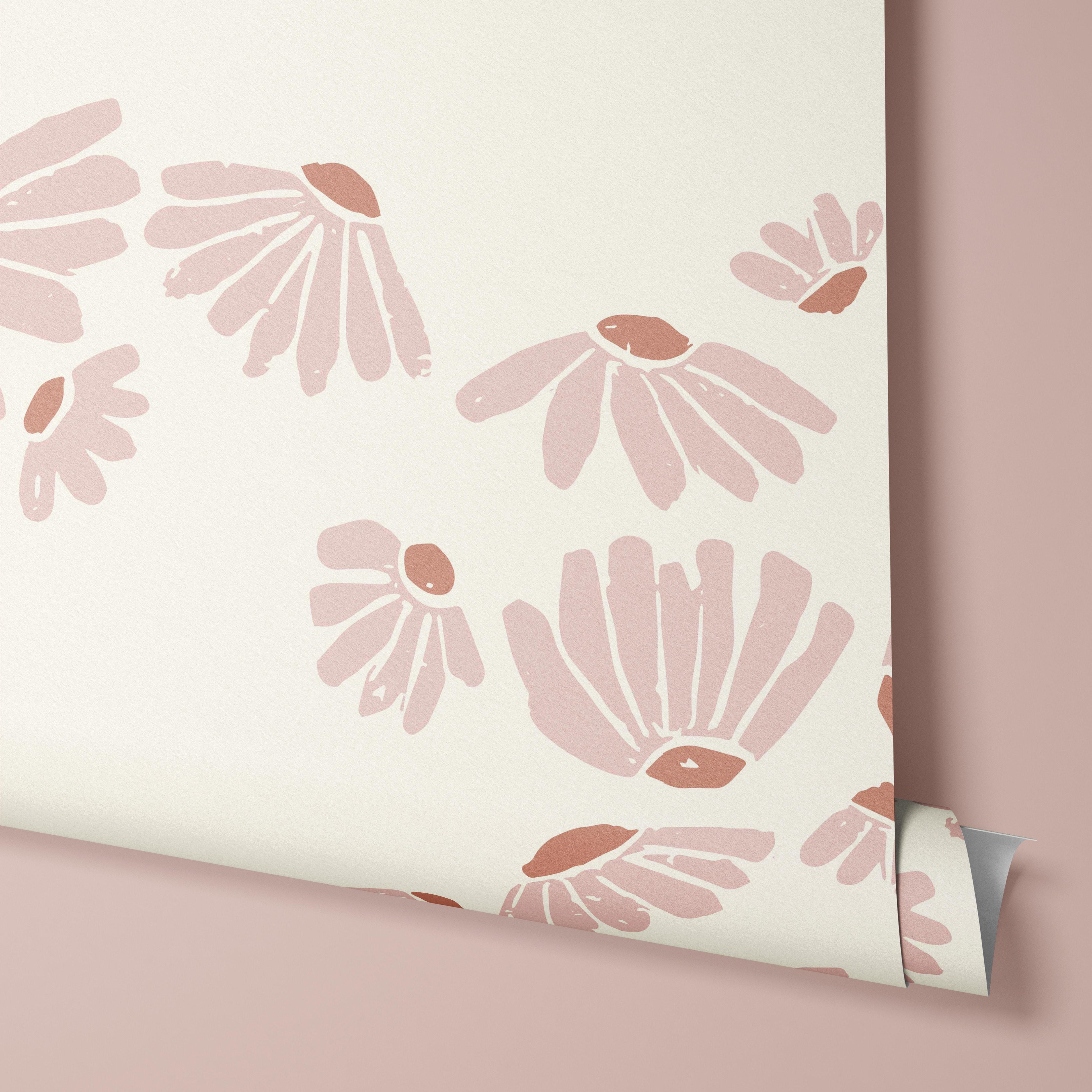 Wallpaper pf baby pink flowers floating on a cream background.