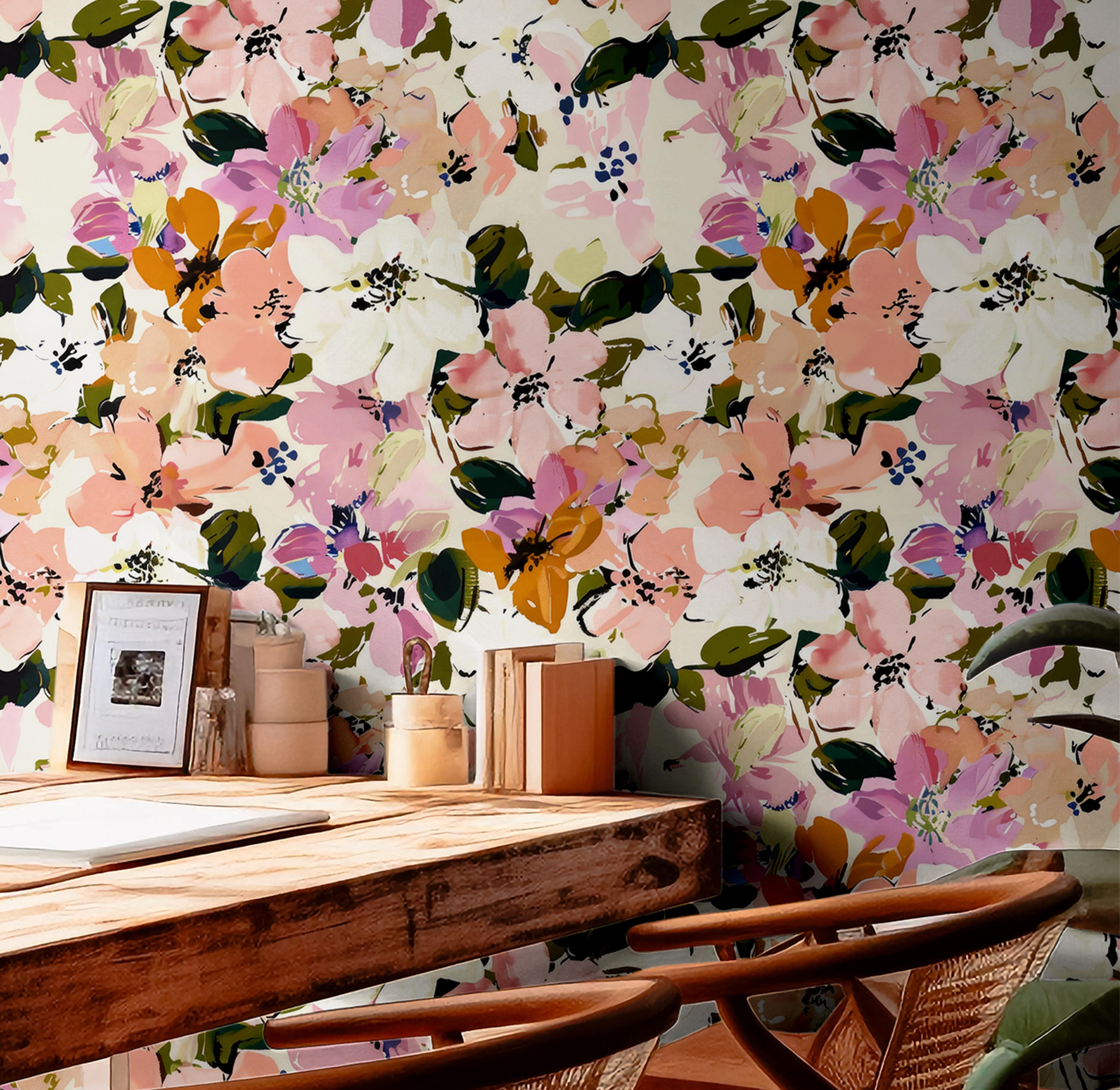 Overlapping pink , yellow, orange, white, and cream flowers as a wallpaper design.