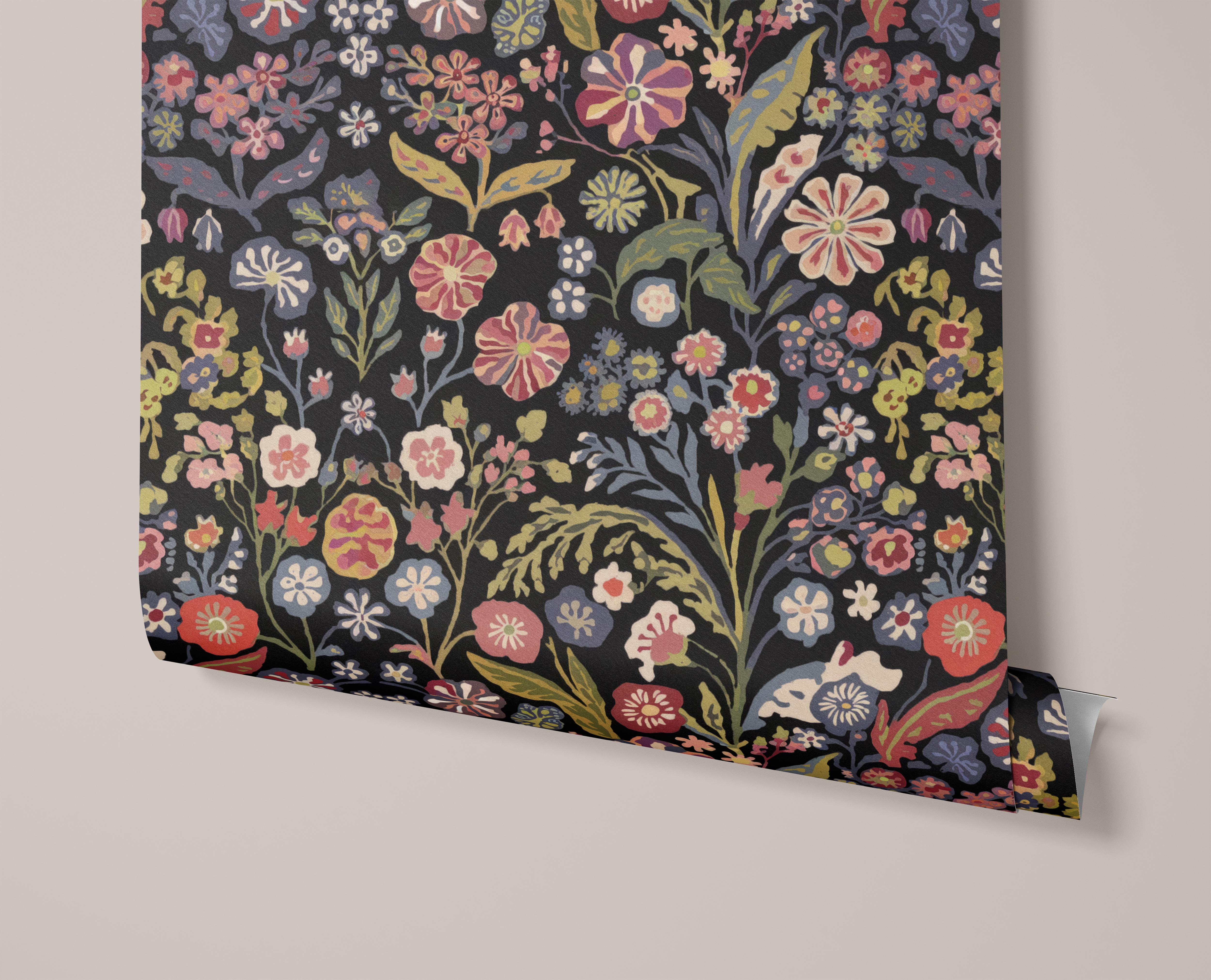 Varying colorful flowers and leaves on a black background.