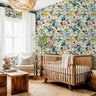 Wallpaper 1648: A vibrant floral wallpaper featuring hand-painted watercolor flowers in shades of blue, pink, and yellow with lush green leaves. The large-scale botanical design creates a statement wall, perfect for nurseries, bedrooms, and accent spaces.