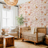 Wallpaper 1654: Warm nursery featuring blush and terracotta floral wallpaper with hand-drawn flowers, styled with natural wood crib, cream chair, and boho accents.