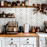 Wallpaper pattern 1670 of painted white streaks in a zig zag pattern on a cream background.