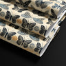 Contact paper 1852: A vintage-inspired butterfly contact paper featuring hand-illustrated black and blue butterflies with delicate sun motifs on a warm cream background, perfect for elegant, nature-inspired decor.