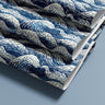 Contact paper 1891: A roll of deep navy blue contact paper featuring hand-drawn ocean waves in a flowing, abstract style, inspired by Japanese wave art, perfect for nautical and coastal interiors.