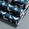 Contact paper 1892: A roll of deep navy blue wallpaper featuring white seagulls and small star accents, evoking a rustic coastal and nautical theme, perfect for beach-inspired interiors.
