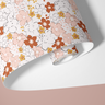 Contact Paper 1916: a roll of contact paper featuring pink, red, white, and yellow flowers on a white background.