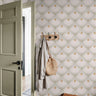 Close-up of Heirloom Crown neutral floral wallpaper showing blush petals, ochre centers, and olive leaf details
