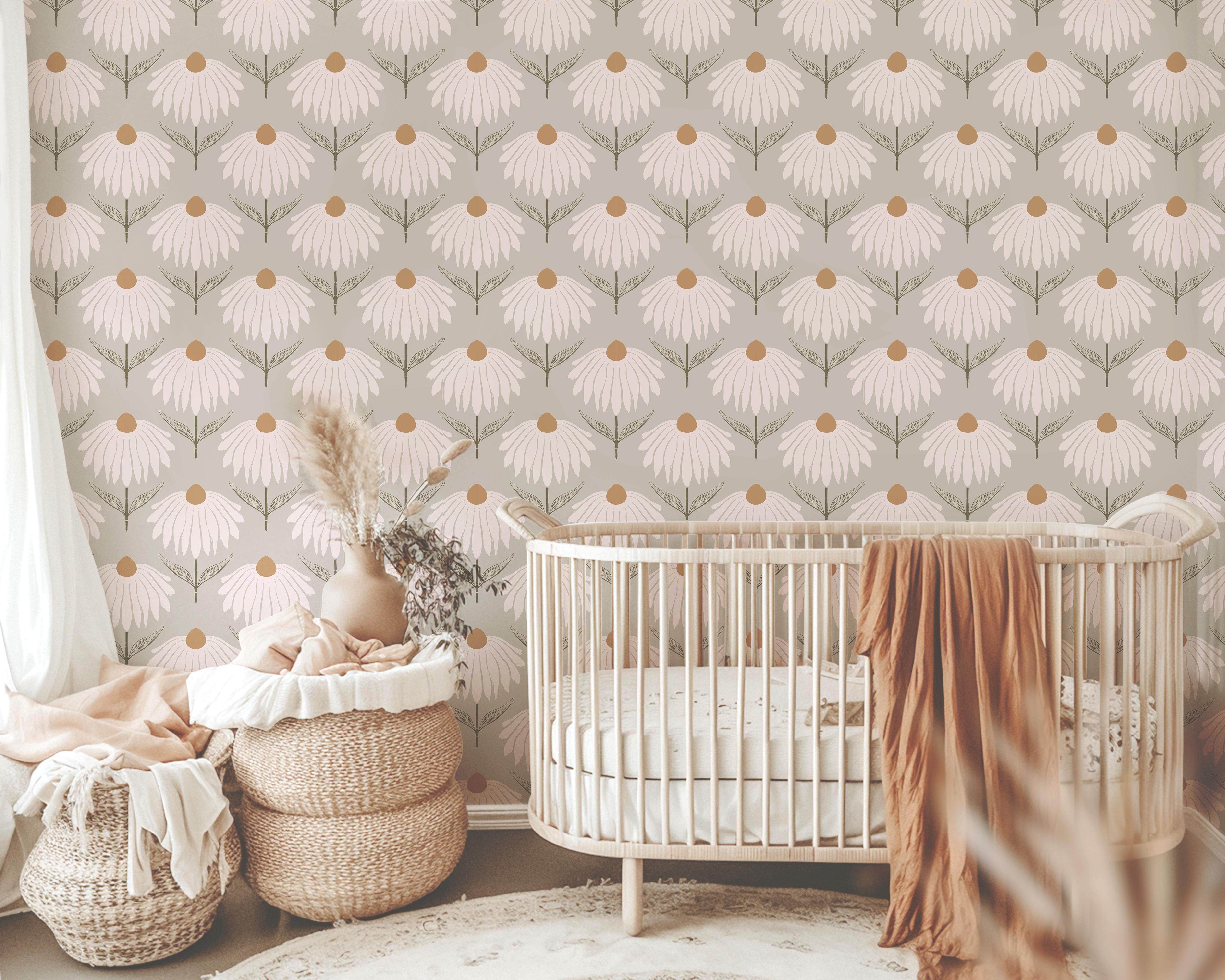 Wallpaper 1944: Wallpaper featuring large blush pink coneflowers with golden ochre centers and sage green leaves on a taupe-beige background, styled in a cozy nursery with a rattan bassinet, soft blankets, and earthy decor.