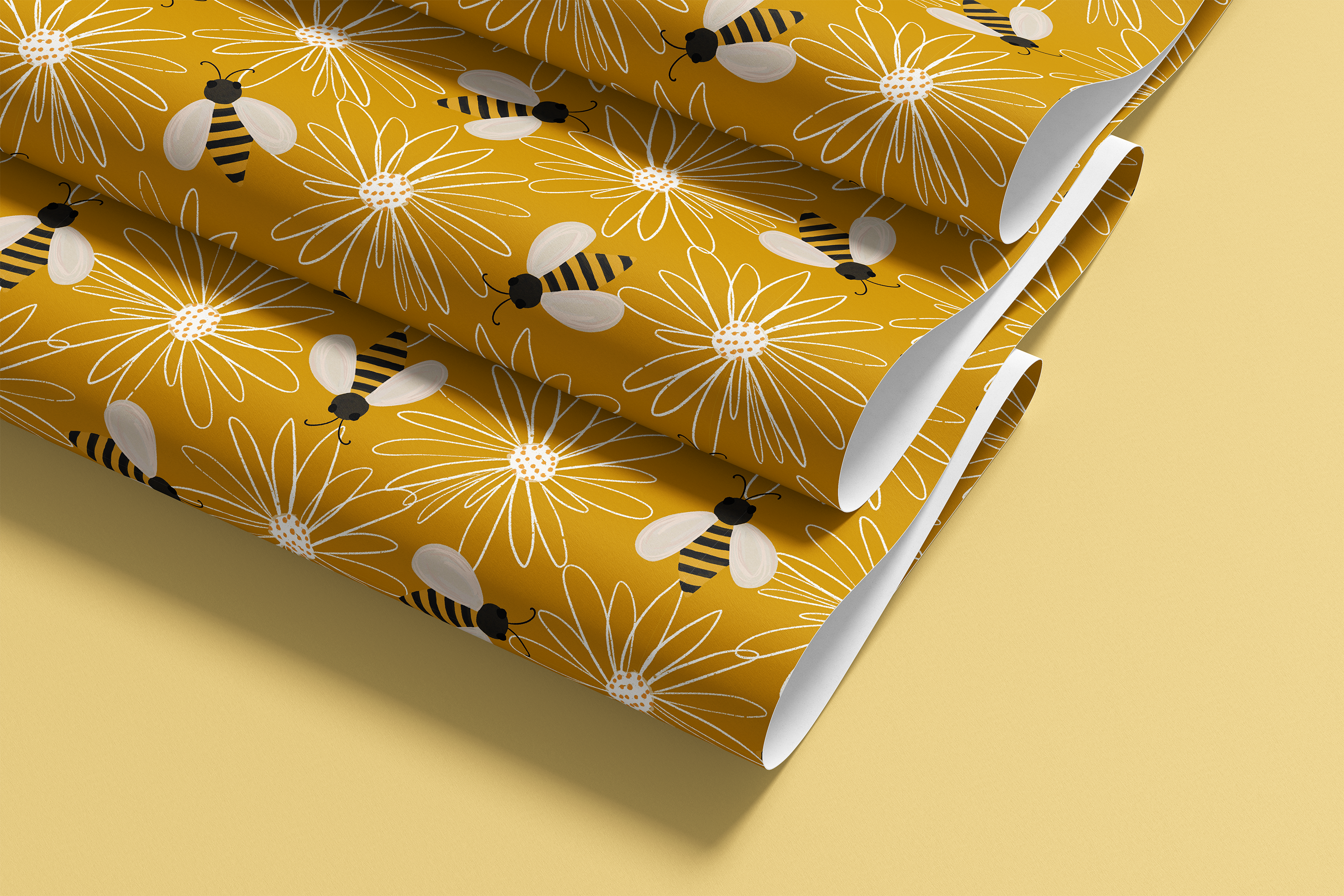 Contact paper 1950: Contact paper featuring a playful bee and daisy pattern on a rich mustard yellow background, with striped bumblebees and white line-drawn florals rolled out on a soft yellow surface.