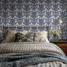 Wallpaper 1954: Elegant blue and white wallpaper featuring a vintage-inspired floral design with intricate hand-drawn botanical elements, perfect for classic and farmhouse bedroom decor.
