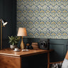 Wallpaper 1966: Repeating damask-style wallpaper with yellow and blue flowers framed in a diamond pattern, shown in a cozy study with wood furniture and dark green paneling.