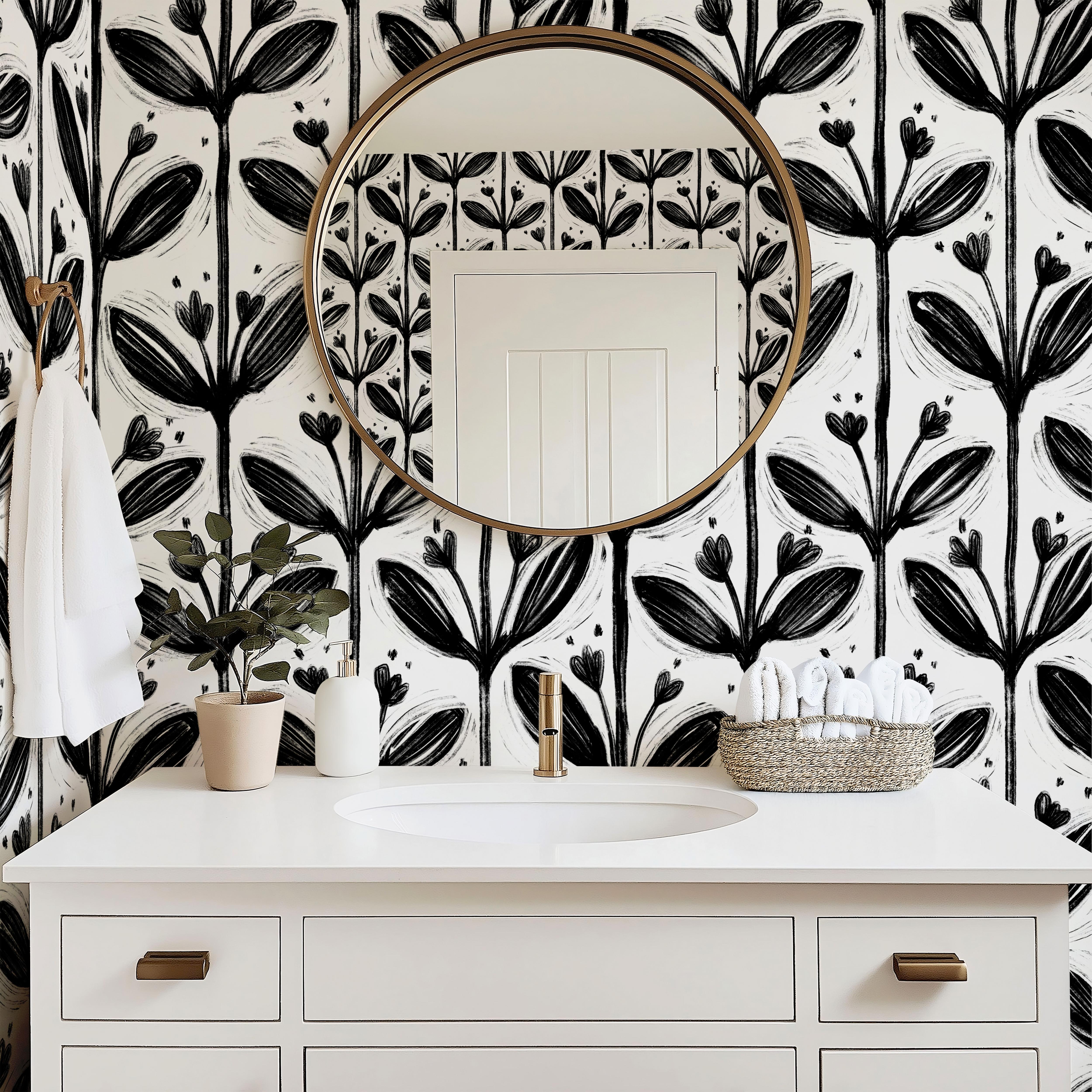 Wallpaper 1982: Modern bathroom with a white vanity and round mirror set against bold black and white floral wallpaper featuring large hand-drawn petal and stem designs for a dramatic, graphic look.