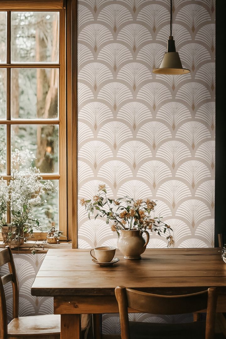 Sandcroft wallpaper in an organic modern dining space featuring warm beige geometric fan motifs