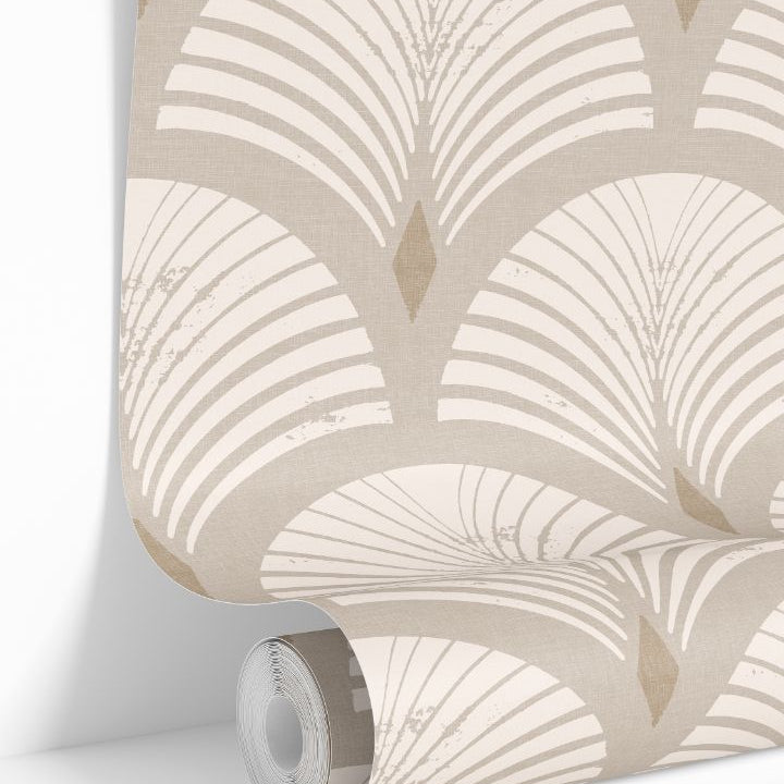 Roll of Sandcroft peel and stick wallpaper showcasing its warm sand and ivory distressed fan pattern.