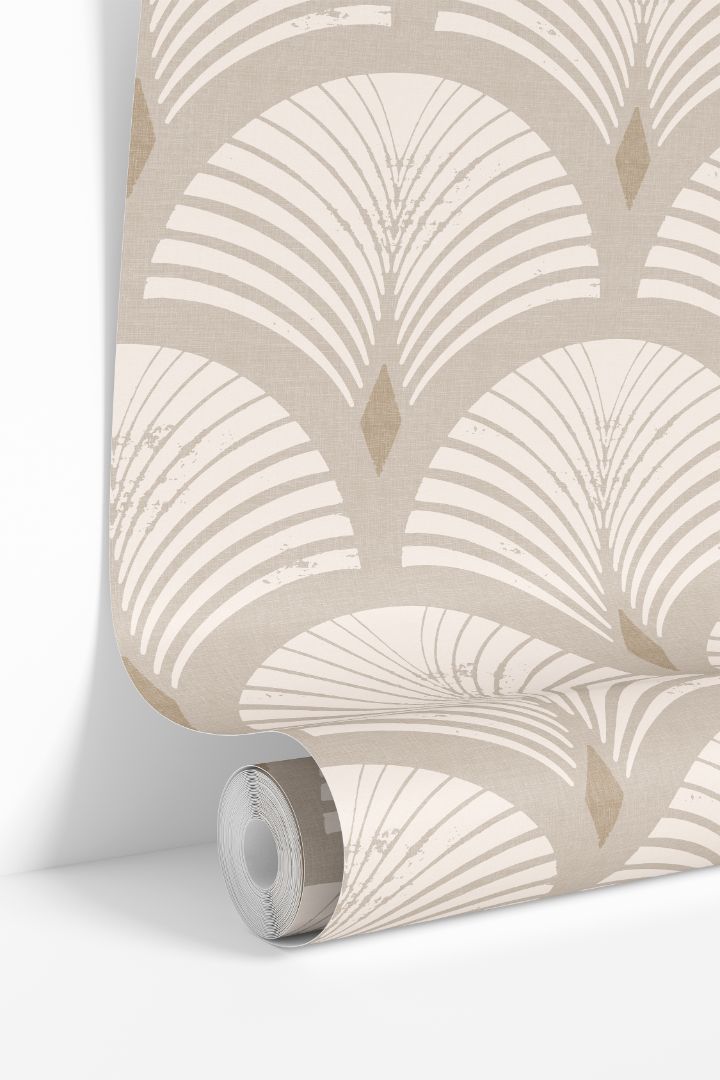 Roll of Sandcroft peel and stick wallpaper showcasing its warm sand and ivory distressed fan pattern.