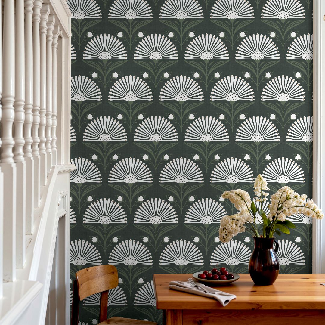 Close-up of green fan leaves in deep sage and forest hues