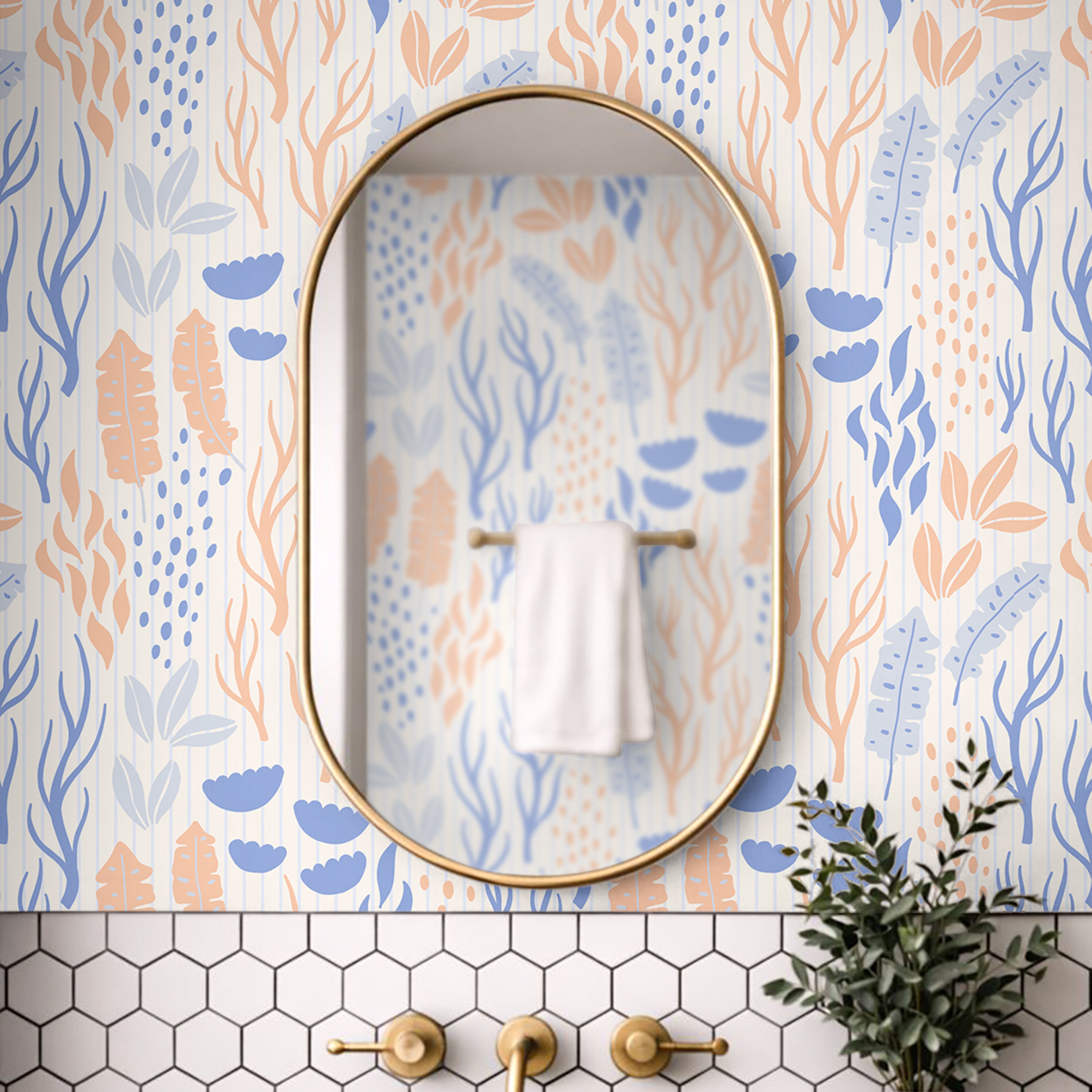 The Sand We Kept wallpaper installed in a coastal bathroom featuring blue botanical artwork and warm brass fixtures.