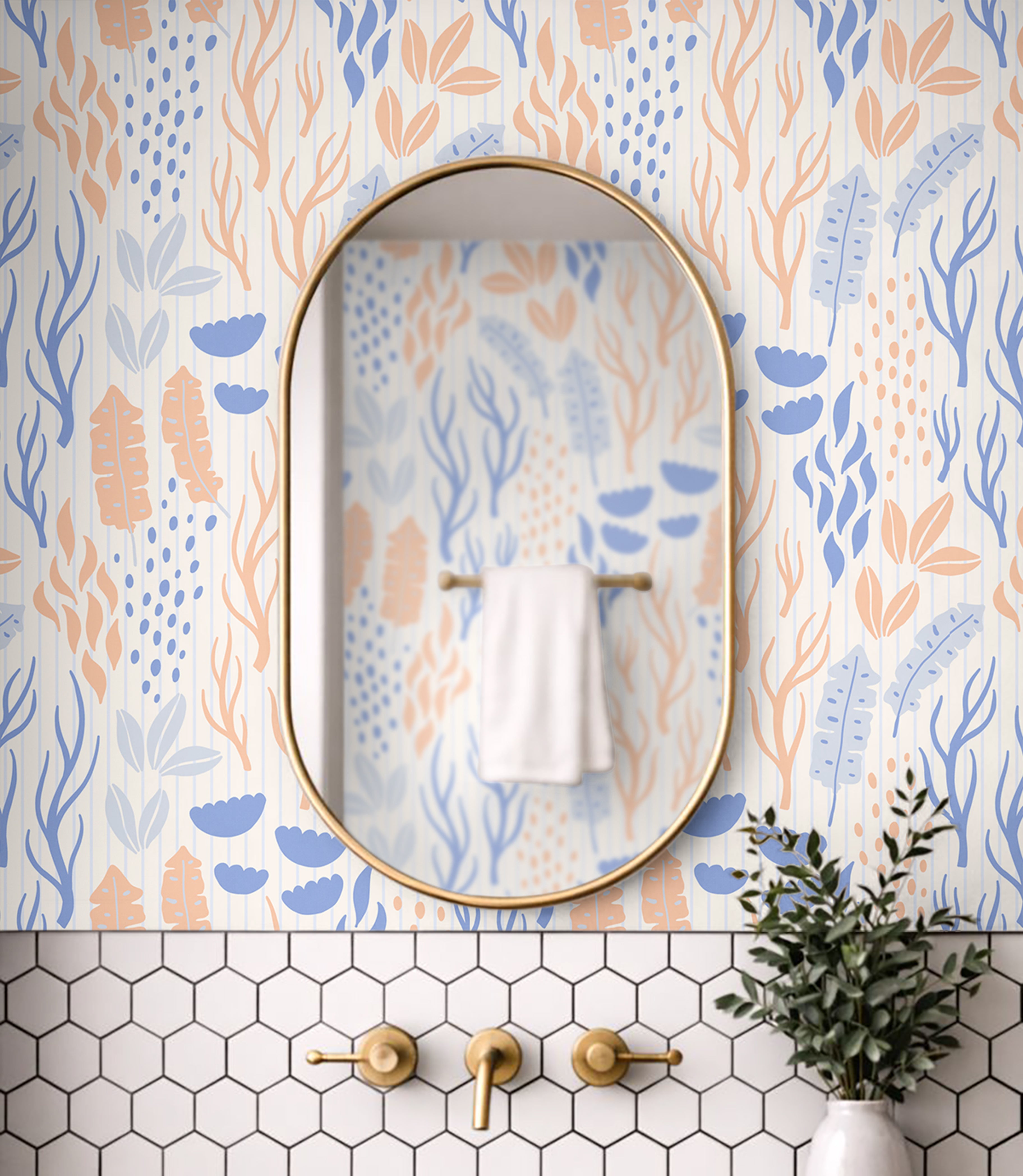 The Sand We Kept wallpaper installed in a coastal bathroom featuring blue botanical artwork and warm brass fixtures.