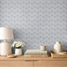 Harbor & Sky blue arch peel and stick wallpaper decorating a modern bedroom with soft geometric pattern.