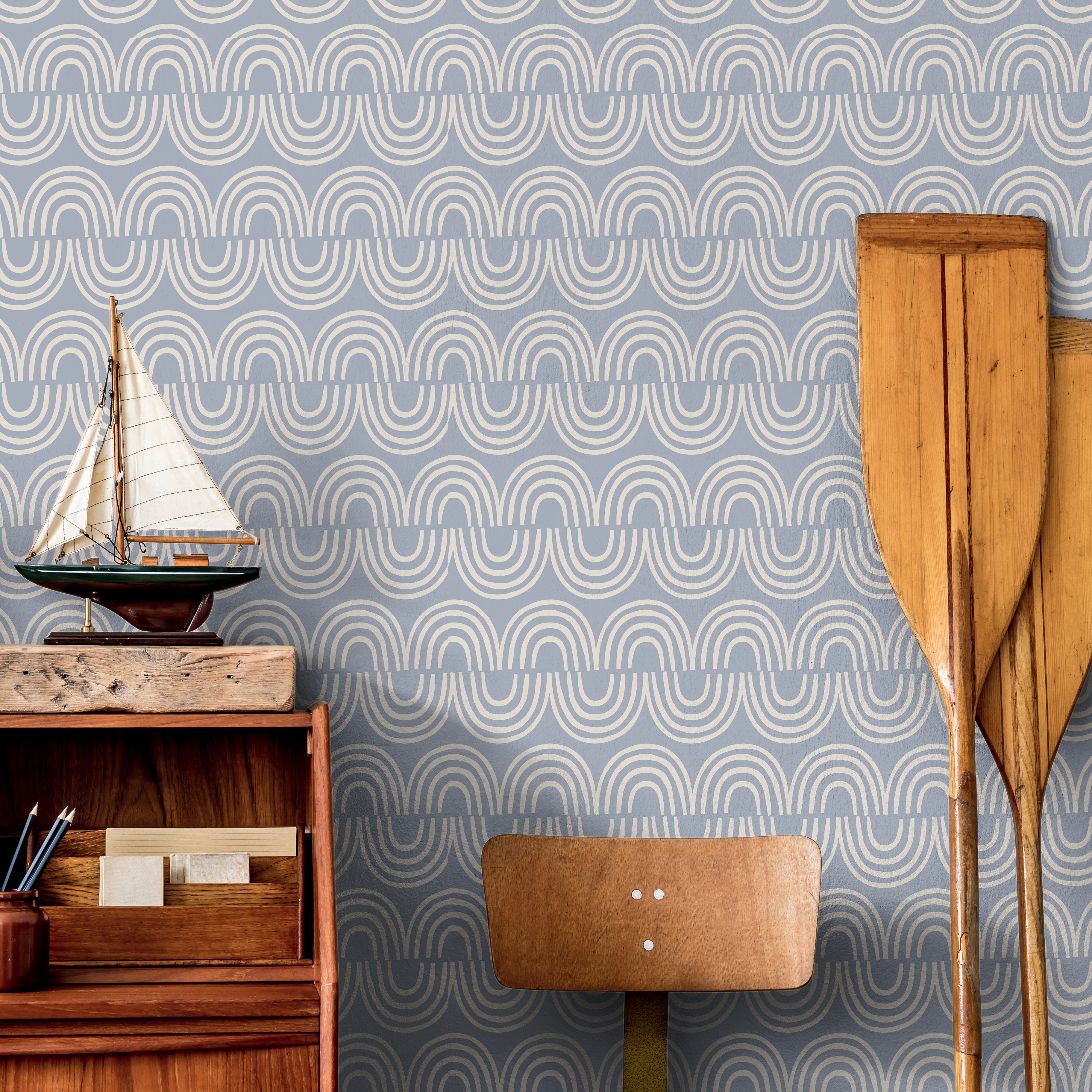 Harbor & Sky wallpaper installed in a nursery featuring calming blue arches and contemporary Scandinavian style.