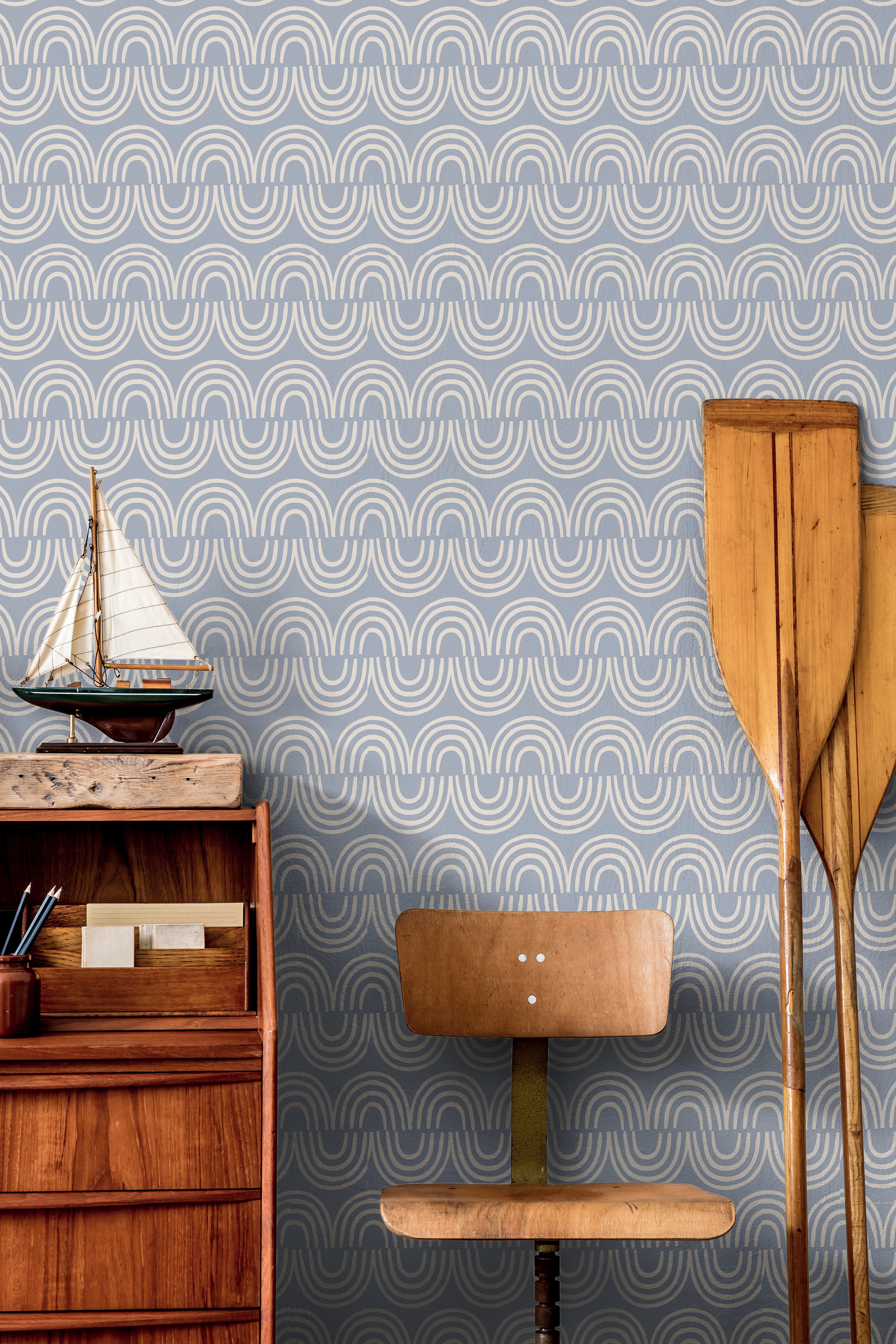 Harbor & Sky wallpaper installed in a nursery featuring calming blue arches and contemporary Scandinavian style.