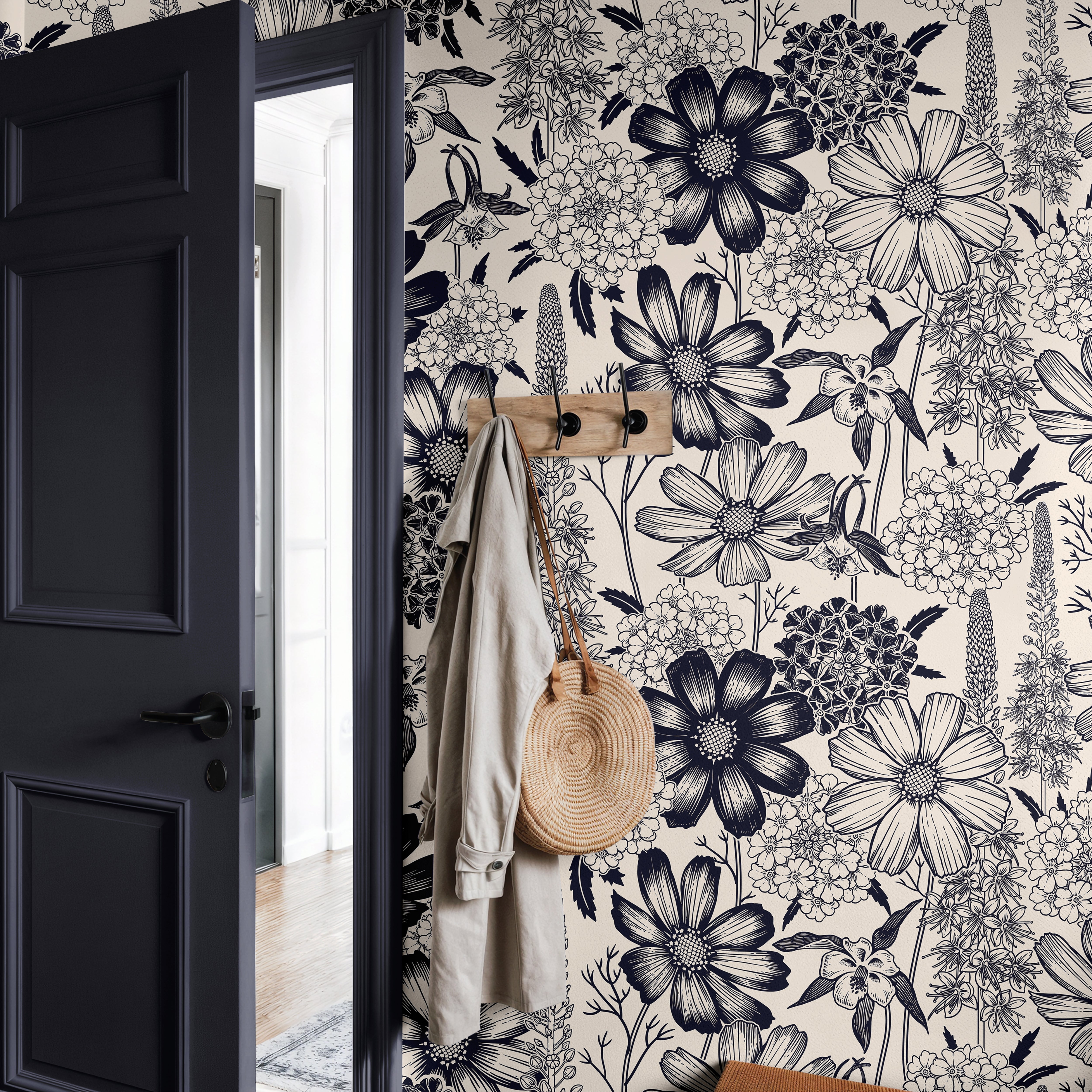 The Grand Botanist large-scale floral wallpaper styled with a grey wood door in a modern entryway.