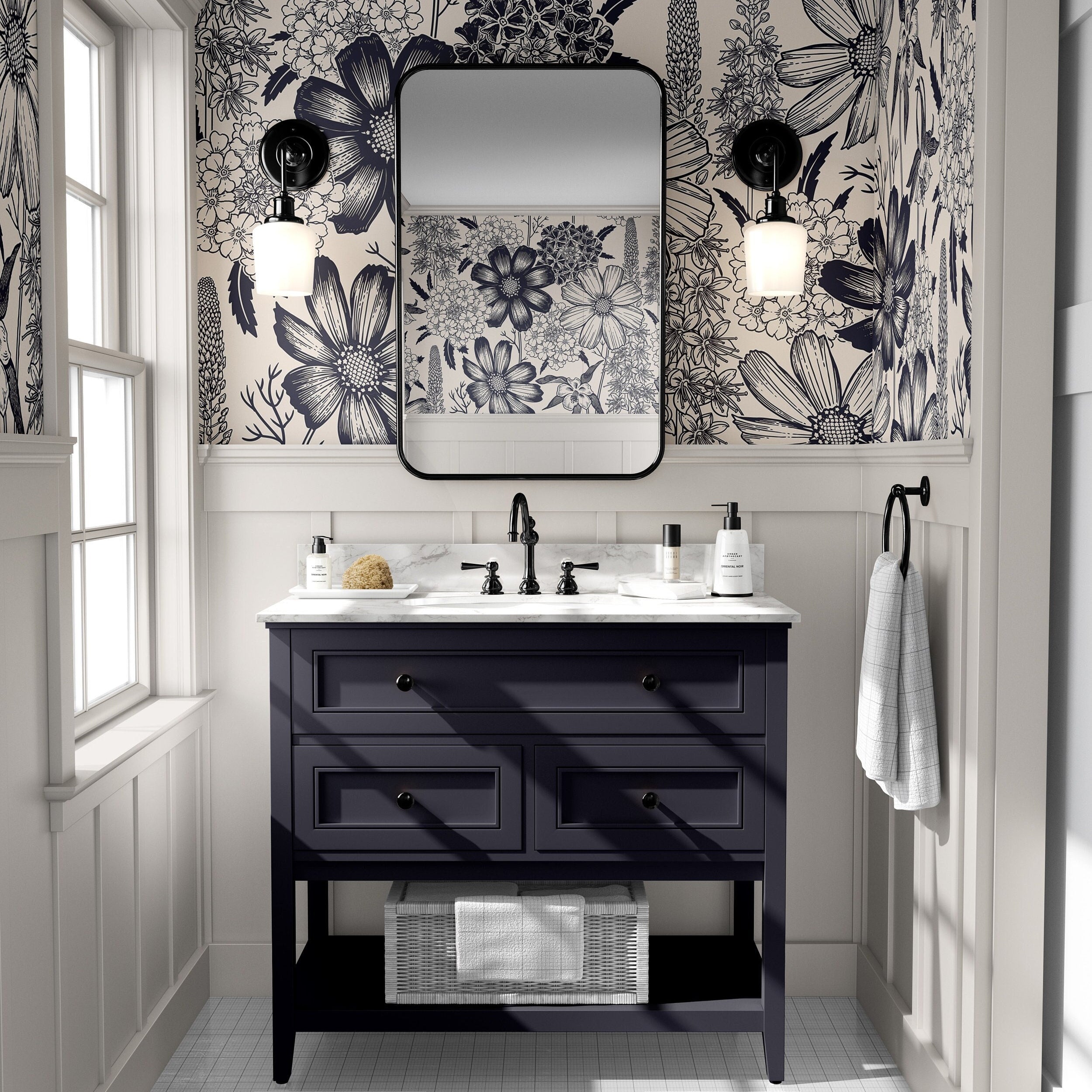 The Grand Botanist navy and cream floral wallpaper installed above white paneling in a classic bathroom.
