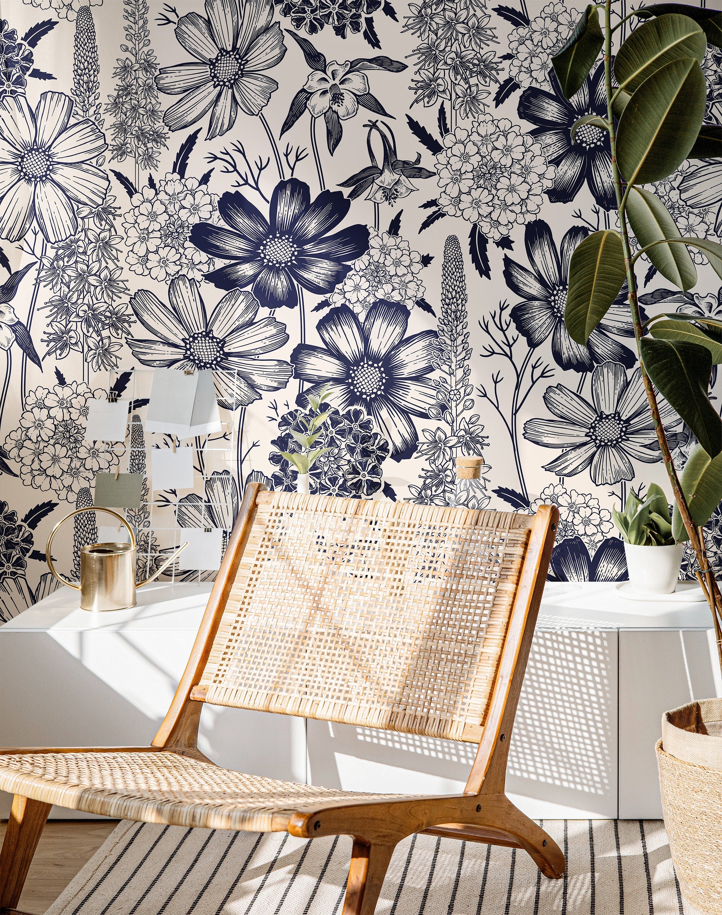 The Grand Botanist navy floral wallpaper creating a bold botanical feature wall in a bright home office.