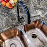 Countertop film 47: A luxurious black and gold agate countertop film with swirling smoky onyx veining, applied around a modern kitchen sink. The waterproof adhesive wrap creates a bold and elegant countertop transformation.