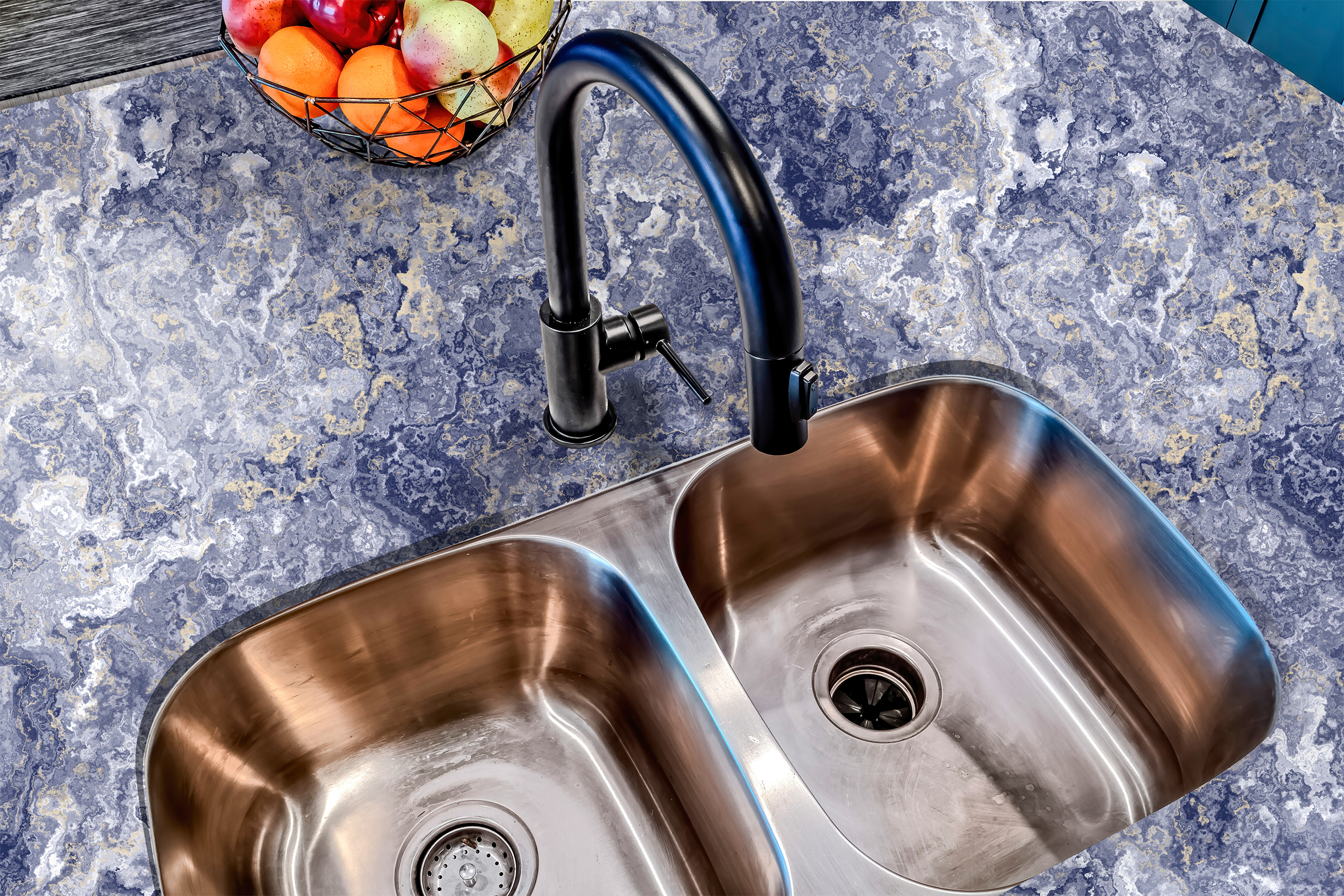 Countertop film 49: A luxurious blue agate countertop film with deep navy and gold veining, applied around a kitchen sink. The waterproof adhesive wrap enhances the countertop with an elegant gemstone-inspired finish.