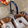 Countertop film 54: A luxurious kitchen countertop featuring a faux marble adhesive film with stunning gold veining, enhancing the space with an elegant and modern aesthetic.
