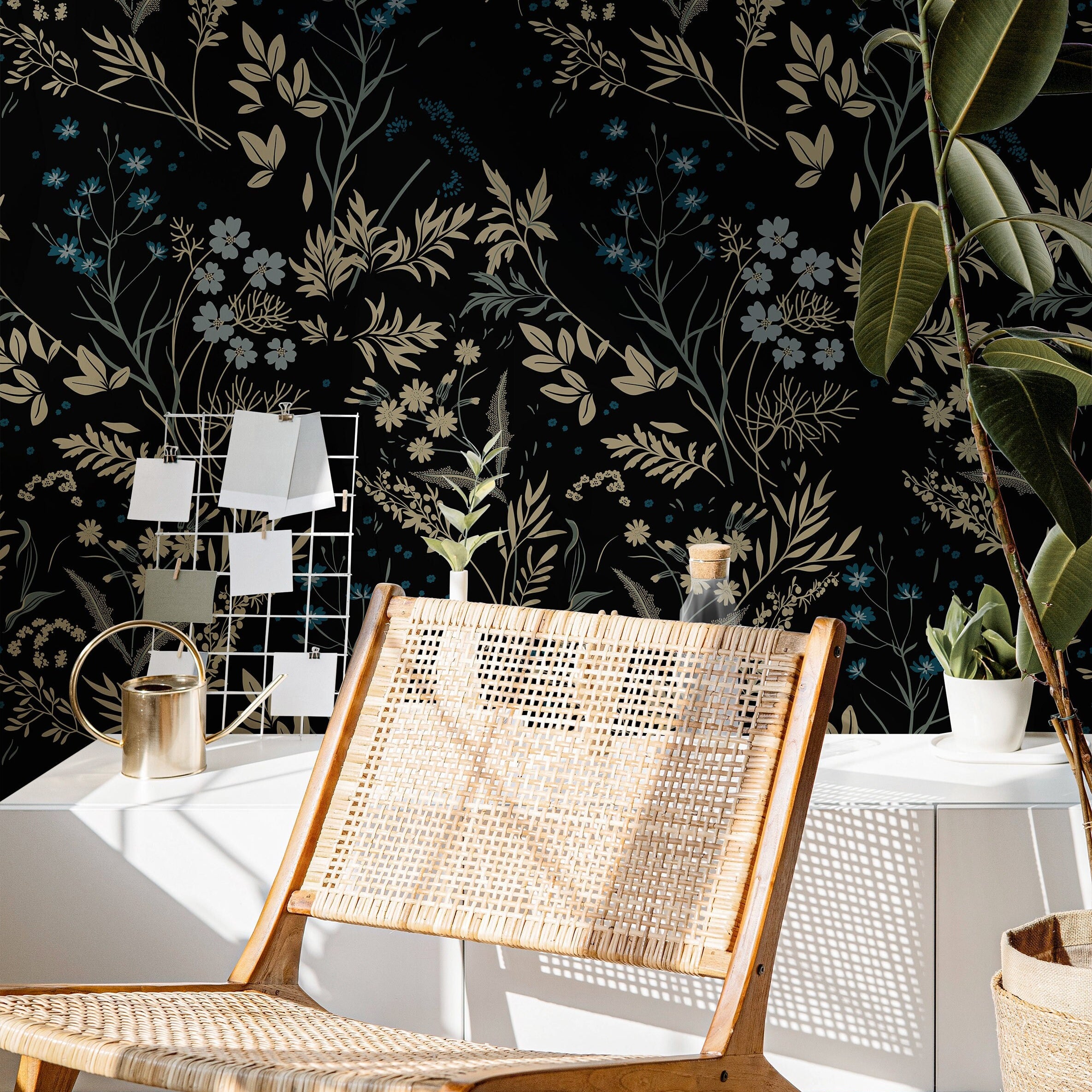 Blackmoor dark botanical wallpaper creating a dramatic home office with woven furniture and green plants