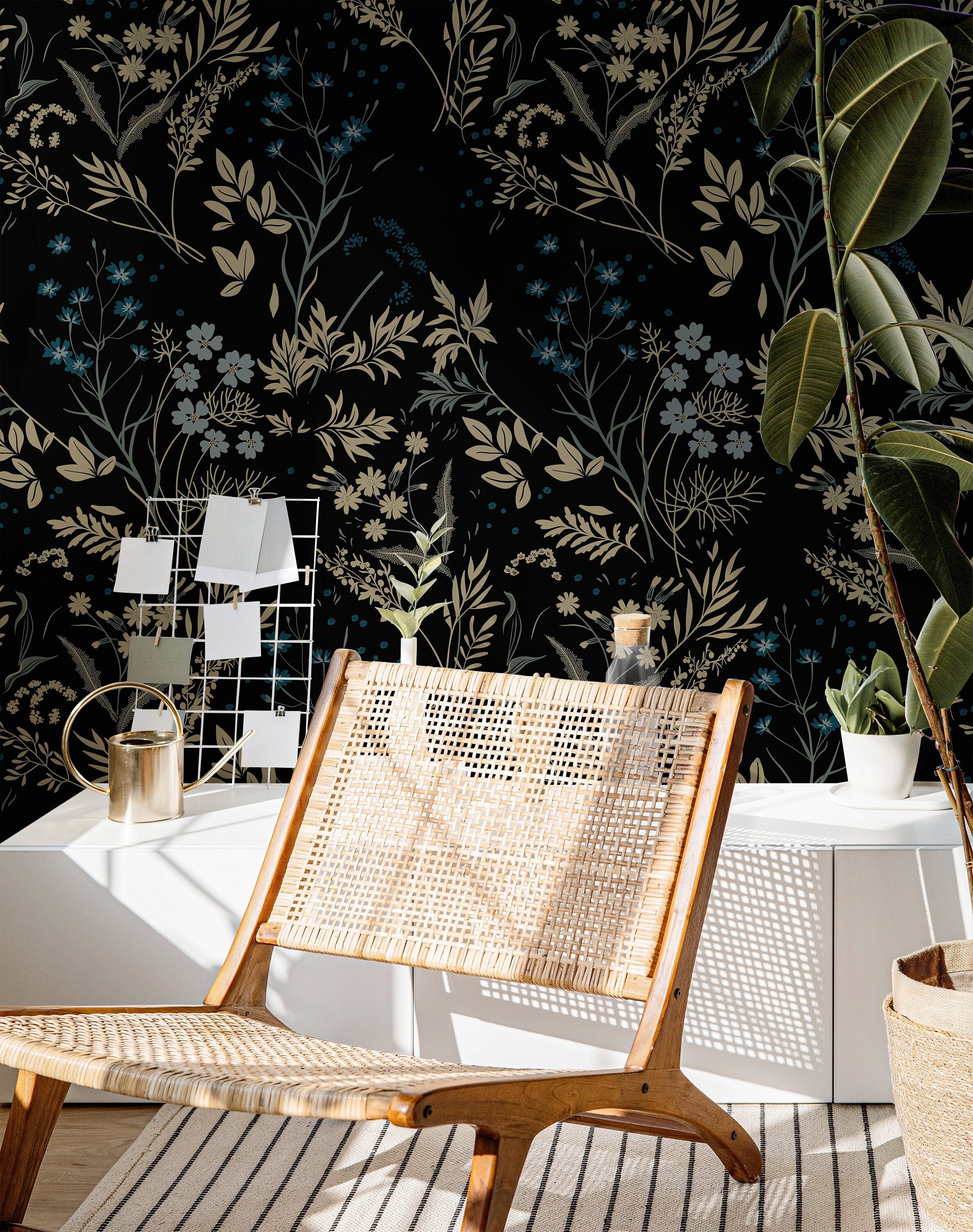 Blackmoor dark botanical wallpaper creating a dramatic home office with woven furniture and green plants