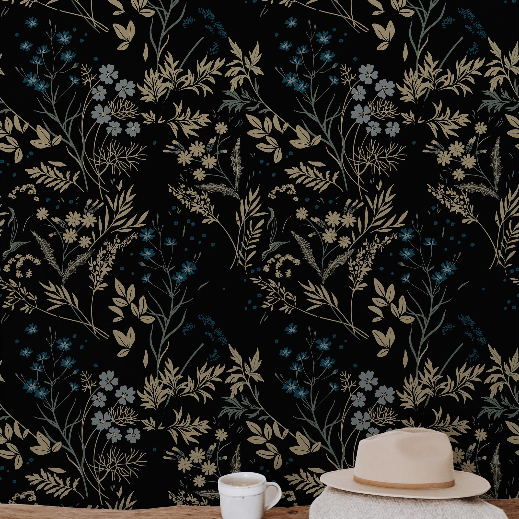Close-up of Blackmoor wallpaper with layered wildflowers, leafy stems, and muted botanical colors on black
