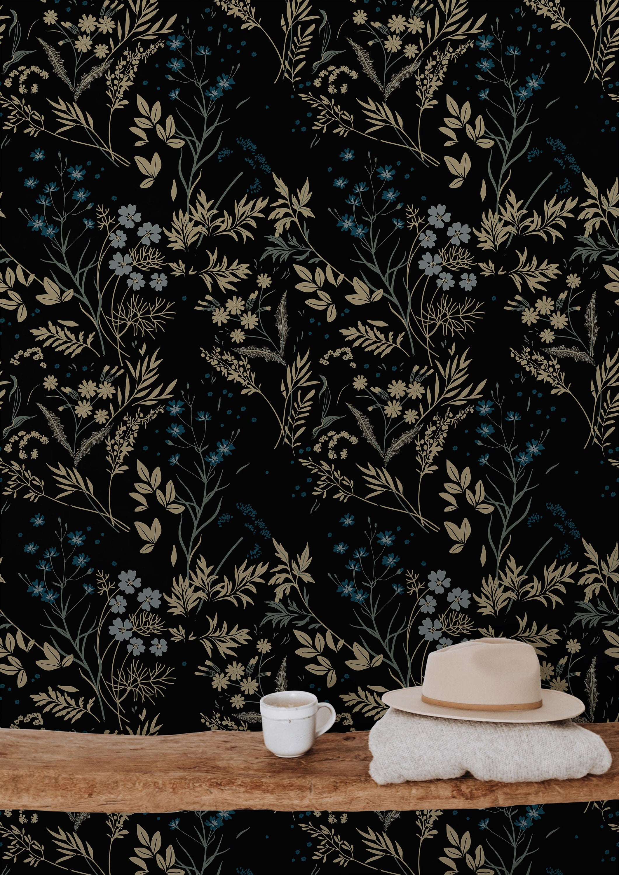 Close-up of Blackmoor wallpaper with layered wildflowers, leafy stems, and muted botanical colors on black