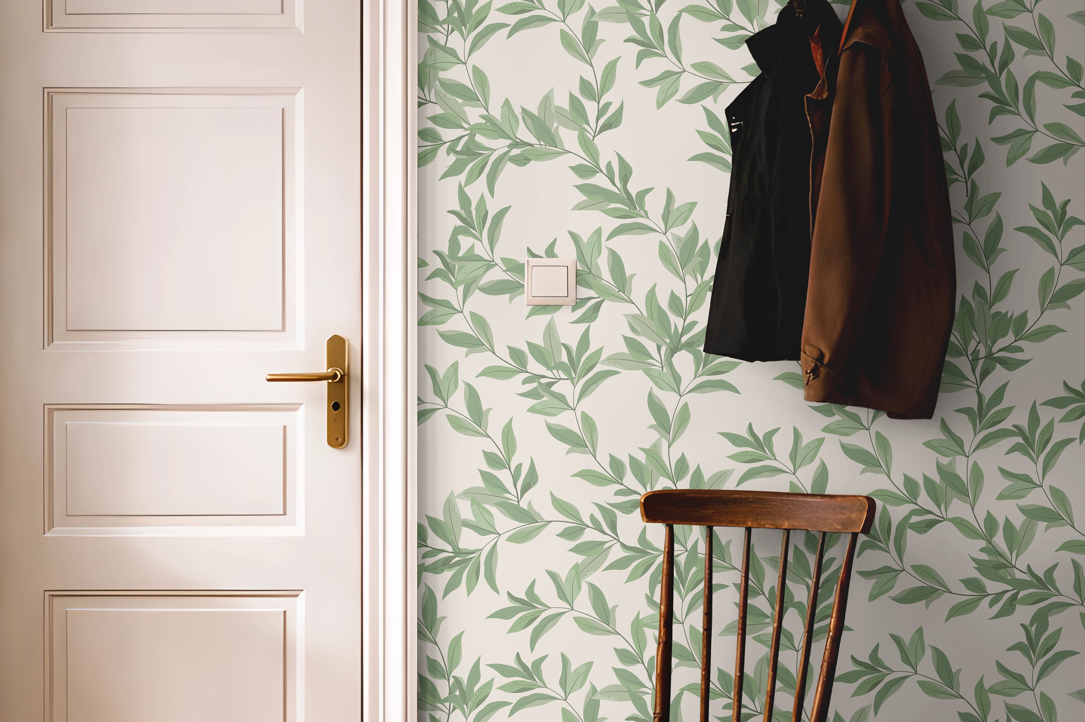 Bright green airy leaves styled with dark wood accents in a warm hallway