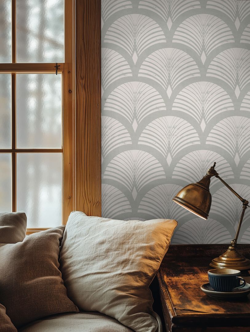 Warm reading corner with Ariscroft Taupe Geometric Wallpaper, brass lamp, and soft neutral pillows