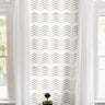 Cream background with black dotted chevron geometrical patterns in modern white living room