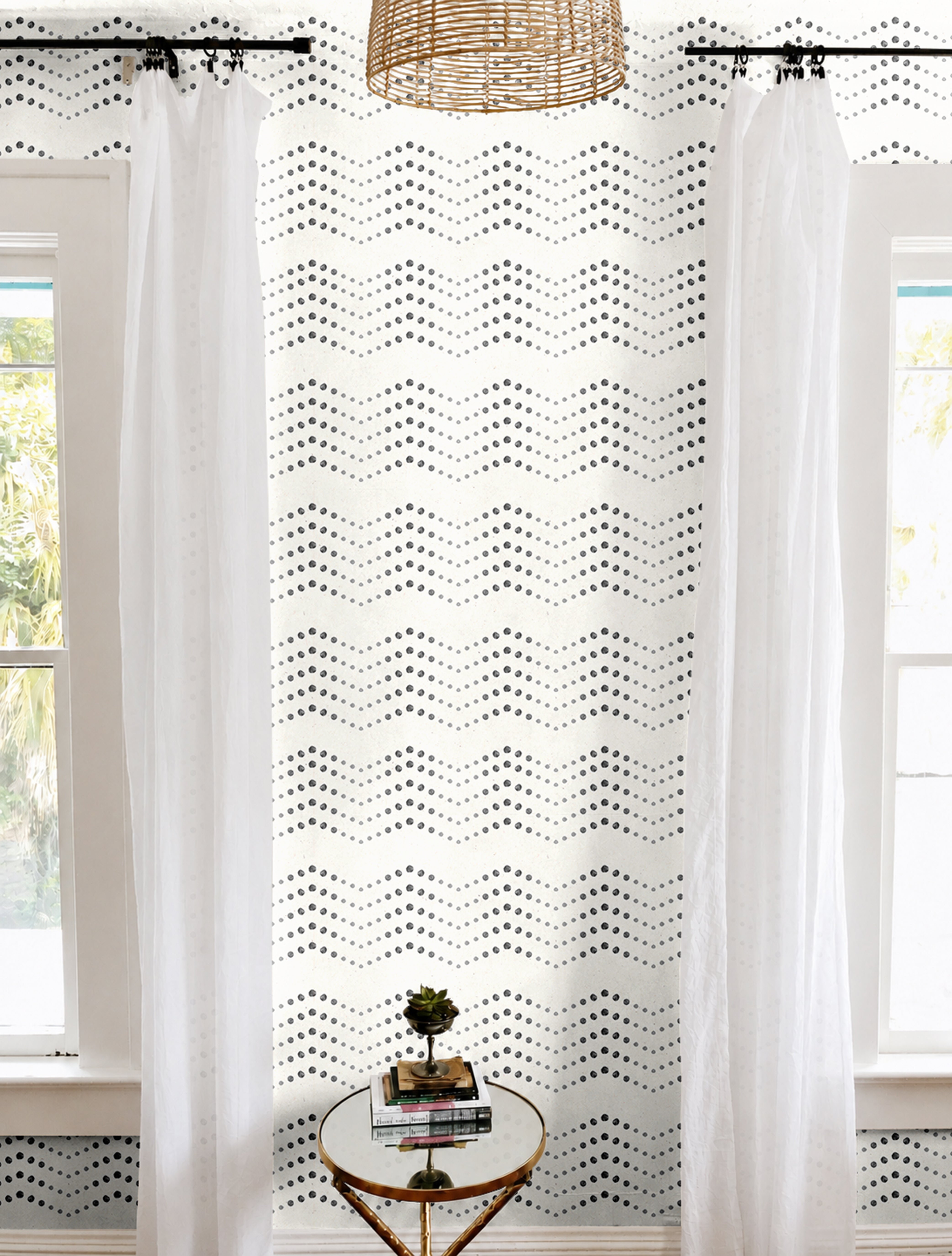 Cream background with black dotted chevron geometrical patterns in modern white living room