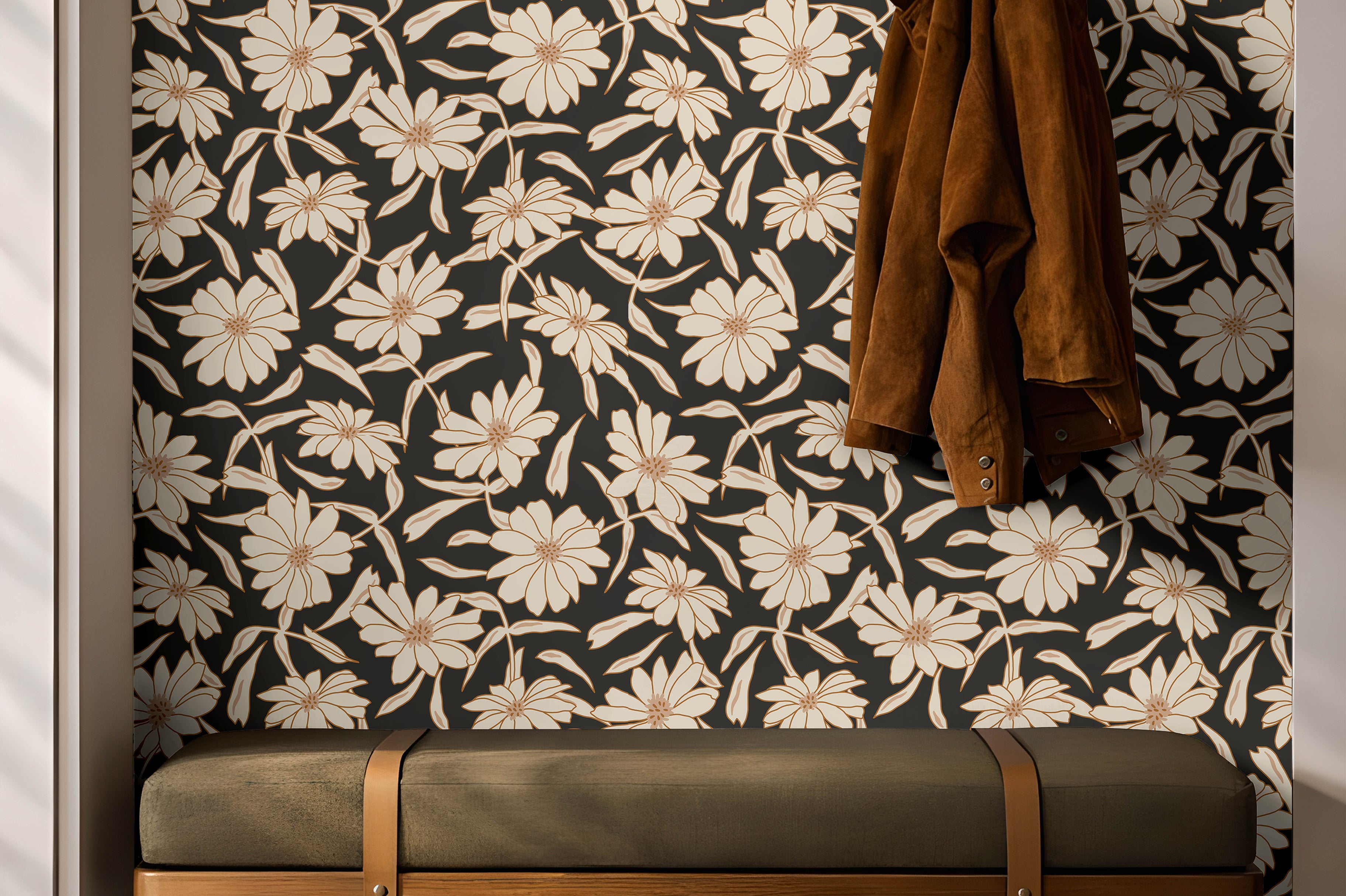 Cream florals on a black background installed in a warm entryway with dark wooden and green accents