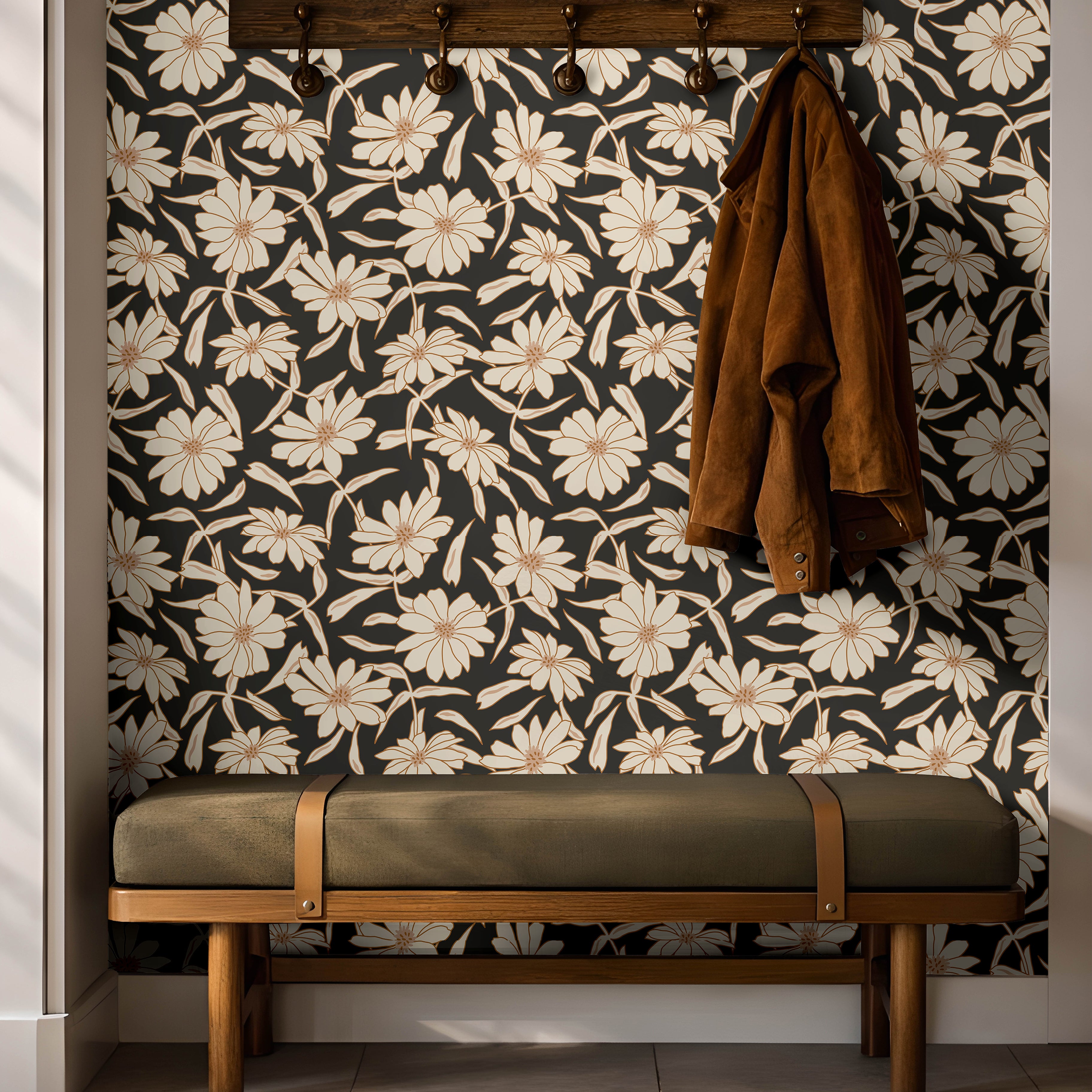 Cream florals on a black background installed in a warm entryway with dark wooden and green accents