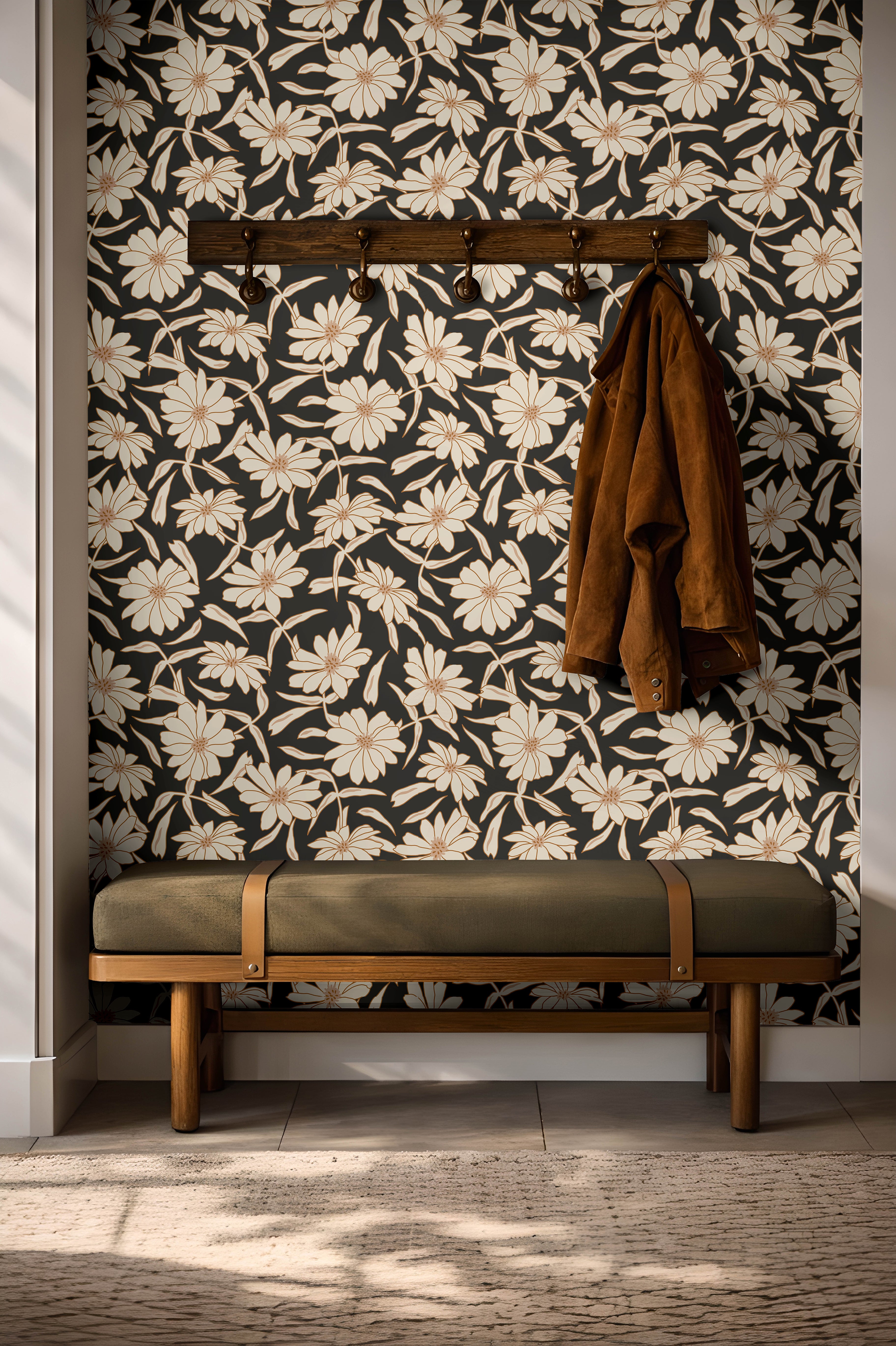 Cream florals on a black background installed in a warm entryway with dark wooden and green accents