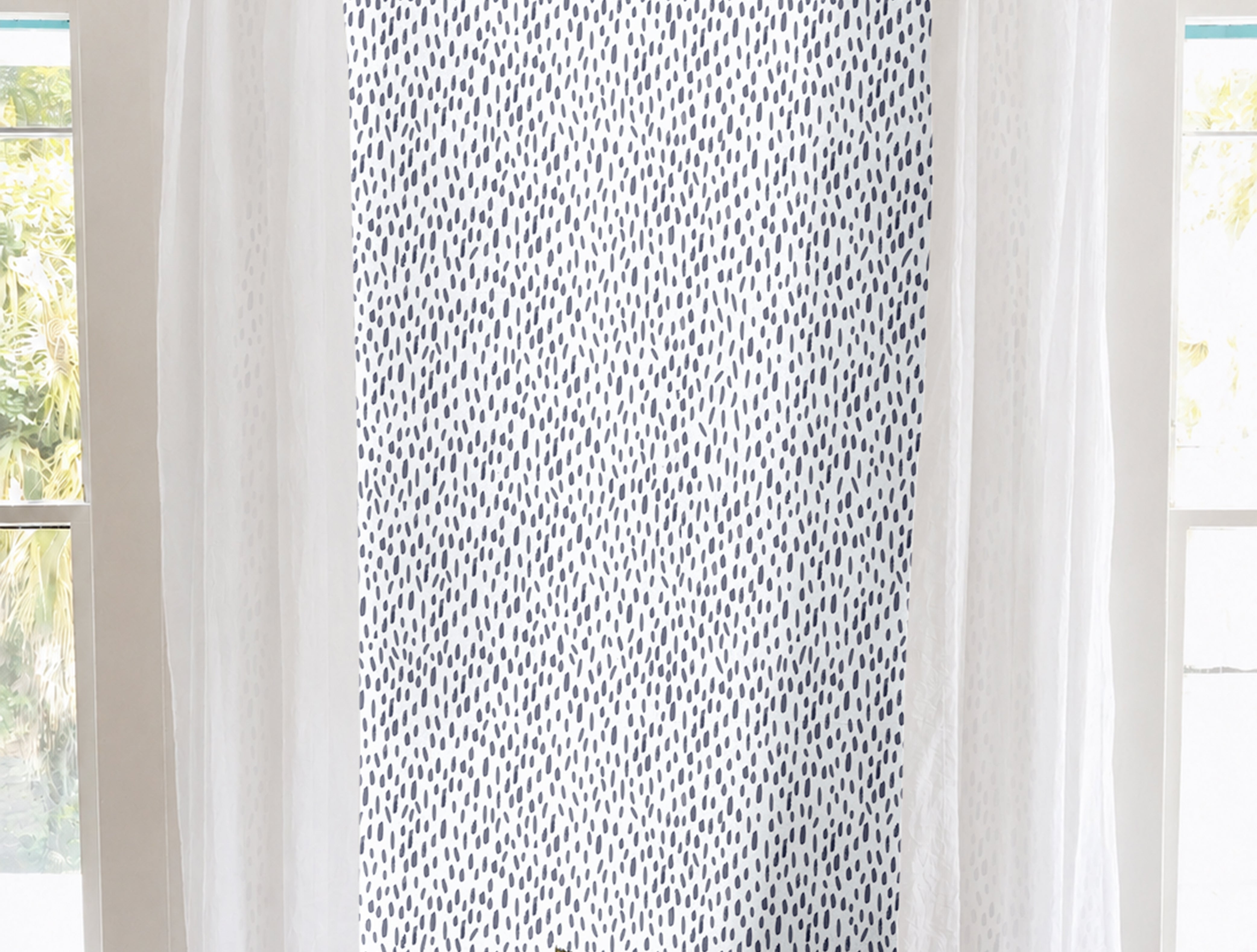 White background with Blue paint strokes in vertical lines creating a nautical vibe in a modern living room