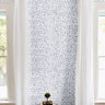White background with Blue paint strokes in vertical lines creating a nautical vibe in a modern living room
