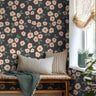 blush pink flowers on navy background in well lit day bed area