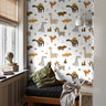 Various dinosaurs in boho colors styled in teens bedroom