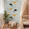 Whales in boho colors styled in a beige themed nursery
